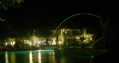 Night time view of Siam Beach Swimming pool and the deluxe rooms behind it