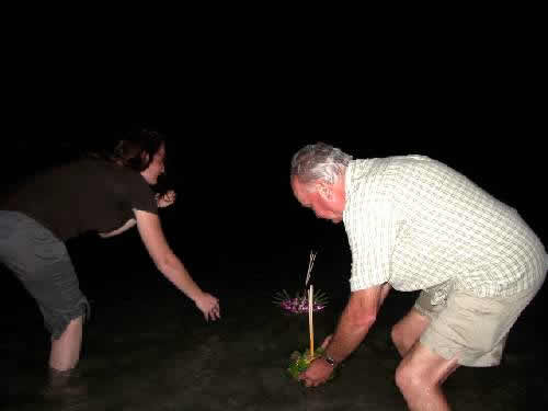 floating a kratong on the sea